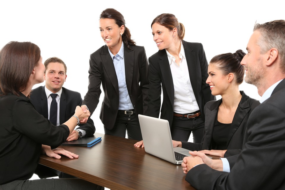a group of business people in a room